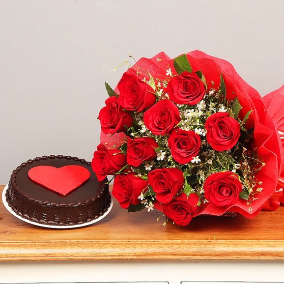 Red Roses and Chocolate Cake with a Red Heart