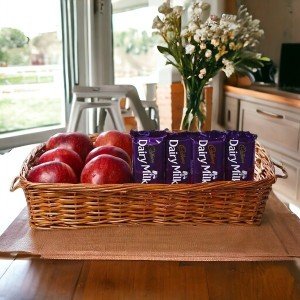 Apples in Basket along with Dairy Milk Chocolates