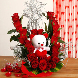 Beautiful arrangement with teddy bear