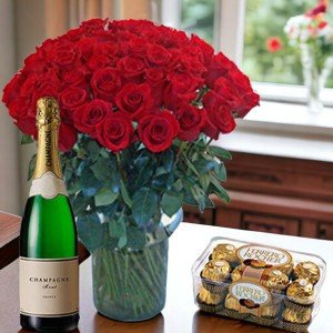 FIFTY RED ROSES VASE WITH FERRERO ROCHER CHOCOLATE AND CHAMPAGNE BOTTLE